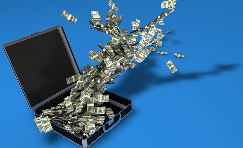 laptop and flying money