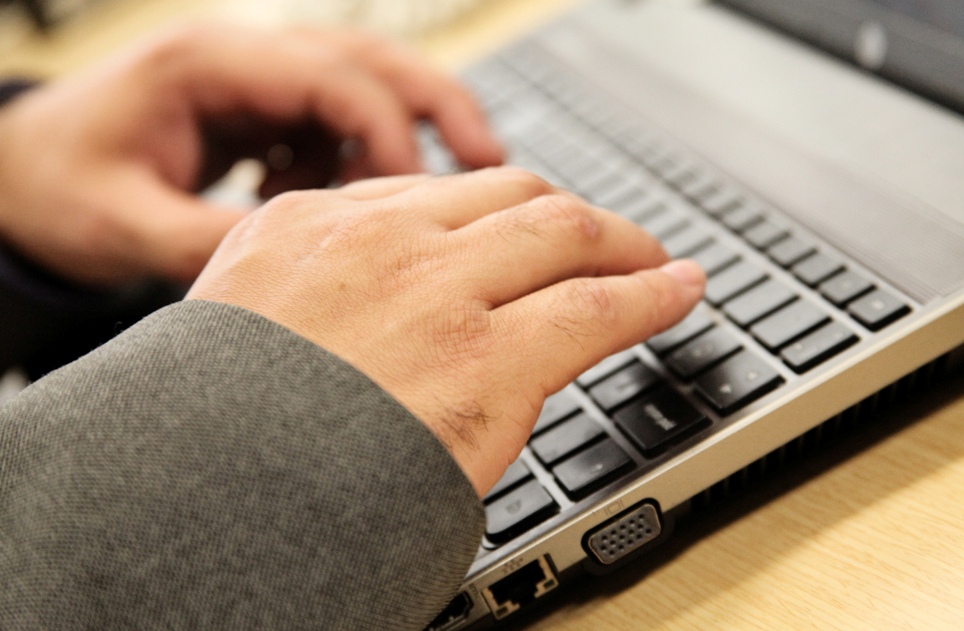 man typing on laptop 2